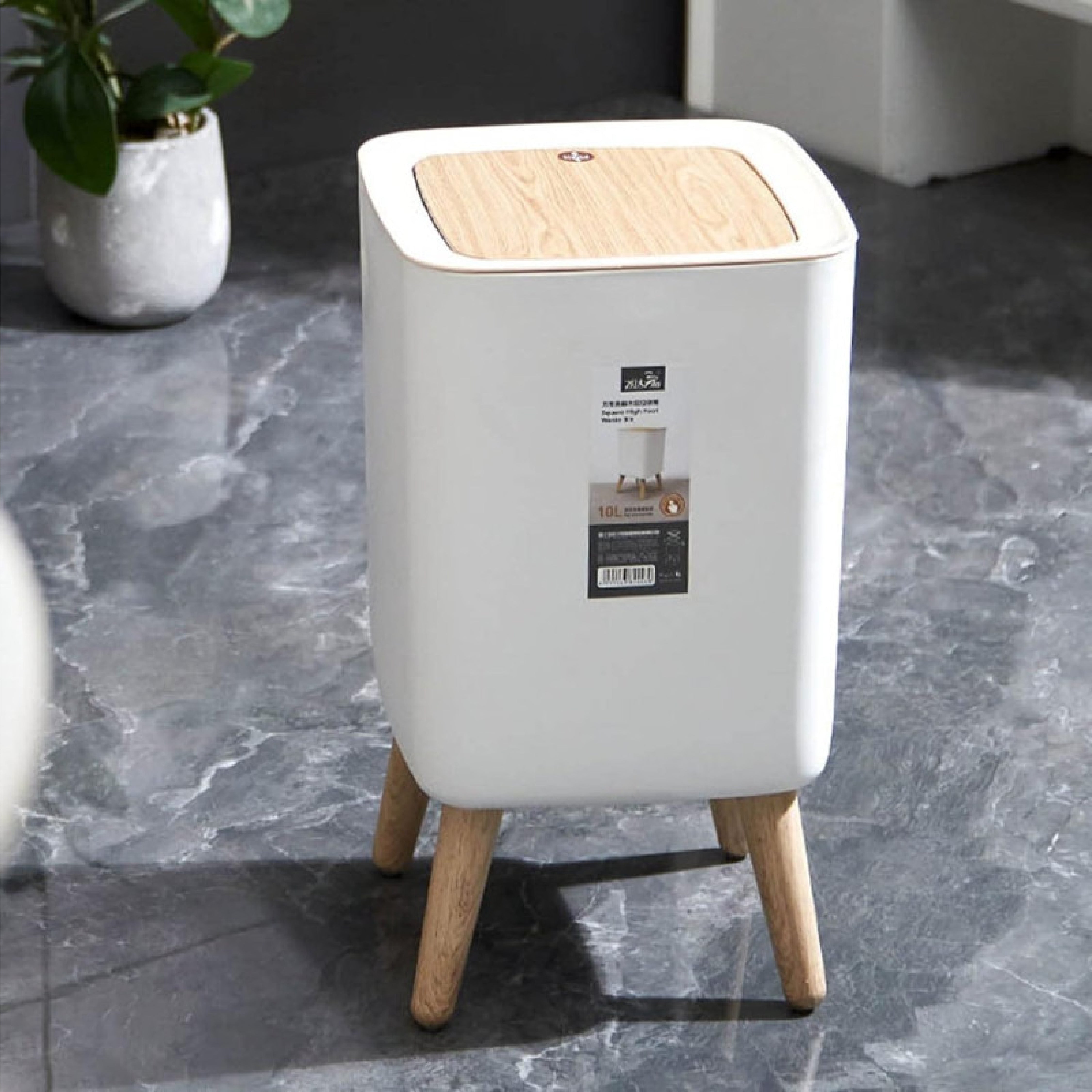 Zidello modern push-open trash bin with wooden lid and legs, compact 10L stylish waste bin for kitchen, bathroom, or office use, durable plastic body with hands-free lid design.