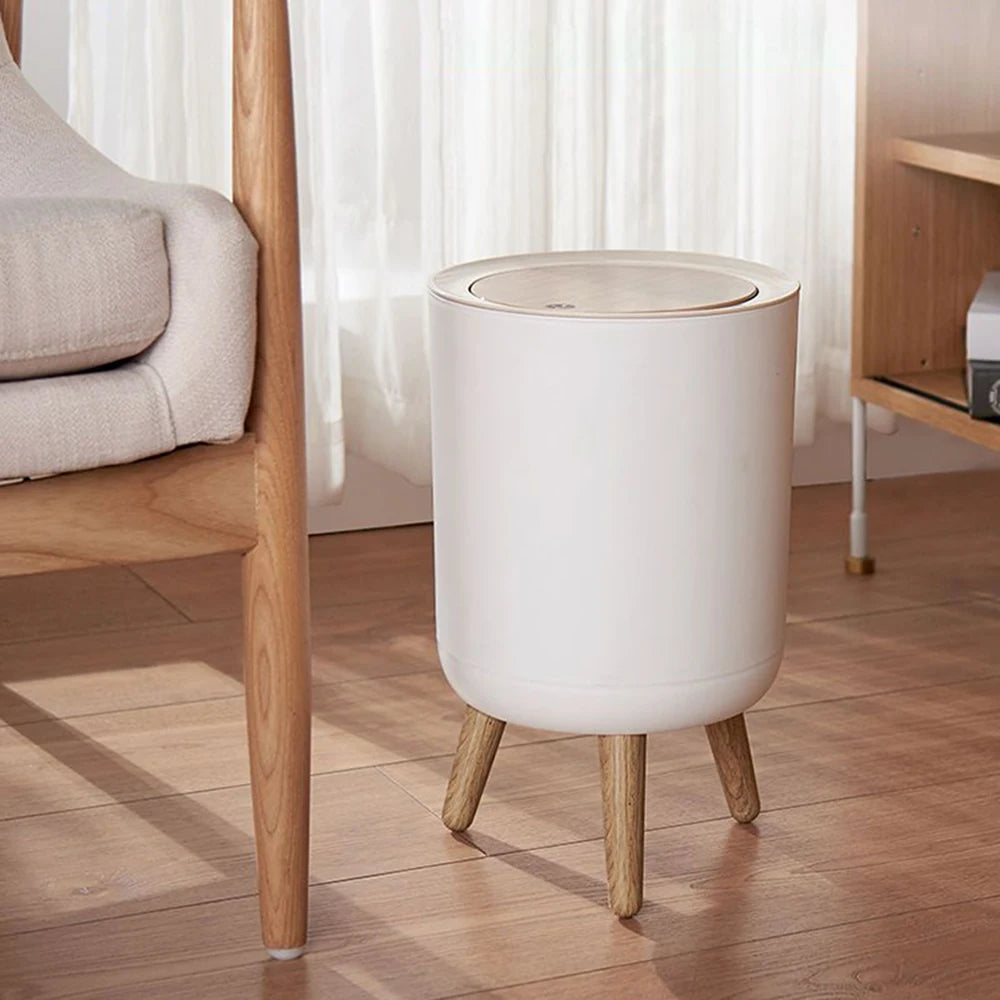 Zidello modern push-open trash bin with wooden lid and legs, compact 10L stylish waste bin for kitchen, bathroom, or office use, durable plastic body with hands-free lid design.