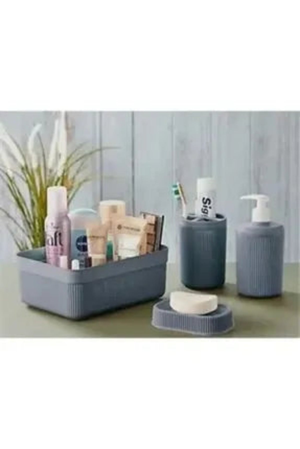"Zidello 4-Piece Bathroom Set – A complete bathroom set featuring elegant and functional essentials. The set includes a soap dispenser, toothbrush holder, tumbler, and a tray, all designed in a sleek, modern style. Crafted with durable materials, the set enhances bathroom decor while providing practical storage solutions."



