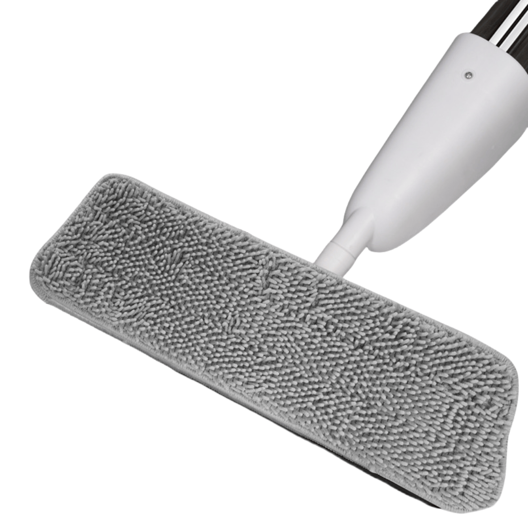 Zidello heavy-duty spray mop with refillable water bottle and flat microfiber mop head spraying cleaning solution on a wooden floor for easy home floor cleaning.